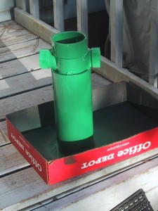 One foot of 4" pvc pipe, with a 3 way T on the top, painted green.