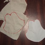 A paper thumb pattern next to muslin fabric