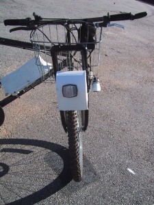 motor mounted over the front tire of a bicycle using PVC pipe