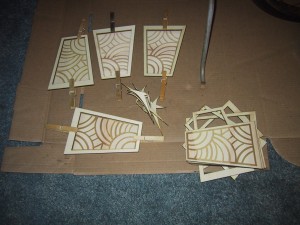 Panels being glued and held together with clothespins.
