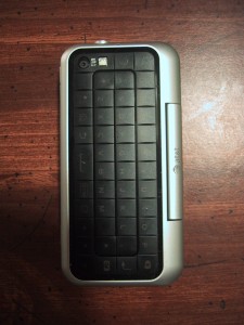 Back of a Backflip cell phone, showing keyboard, camera and LED flash.
