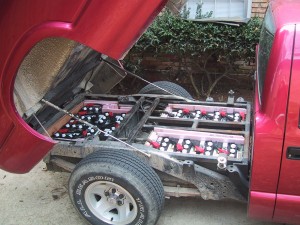 16 six volt batteries under the tilt-bed of the pickup