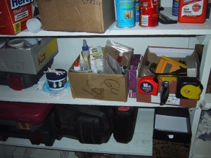 Garage shelves organized with cardboard boxes