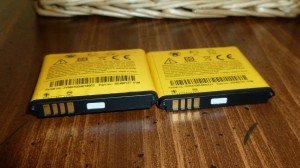 two liion batteries, one bulging and old, the other new