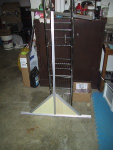 One side panel of the frame, triangular bottom with a tall upright in the center