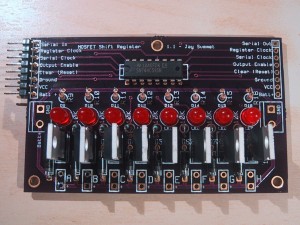 Circuit board with 8 LED's and 8 MOSFETS connected to a 74HC595 shift register