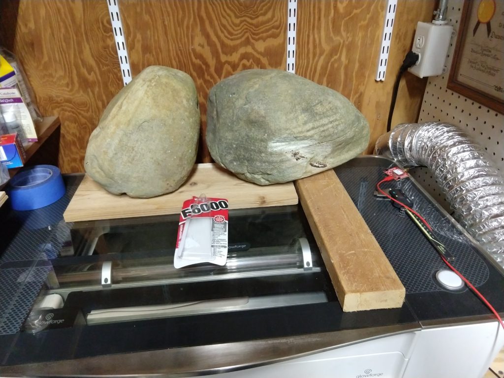 Rocks holding the lid down